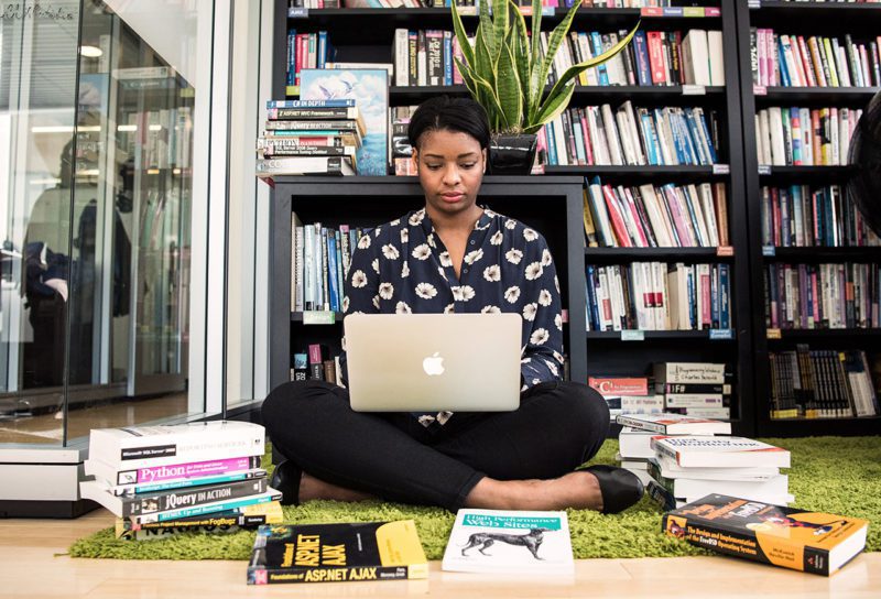 Entrepreneur searching for funding on her computer