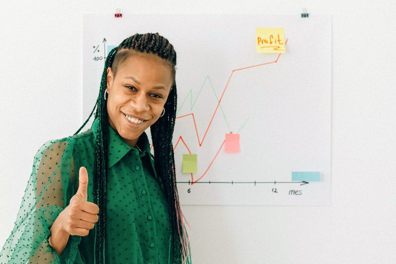 Woman giving thumbs up sign