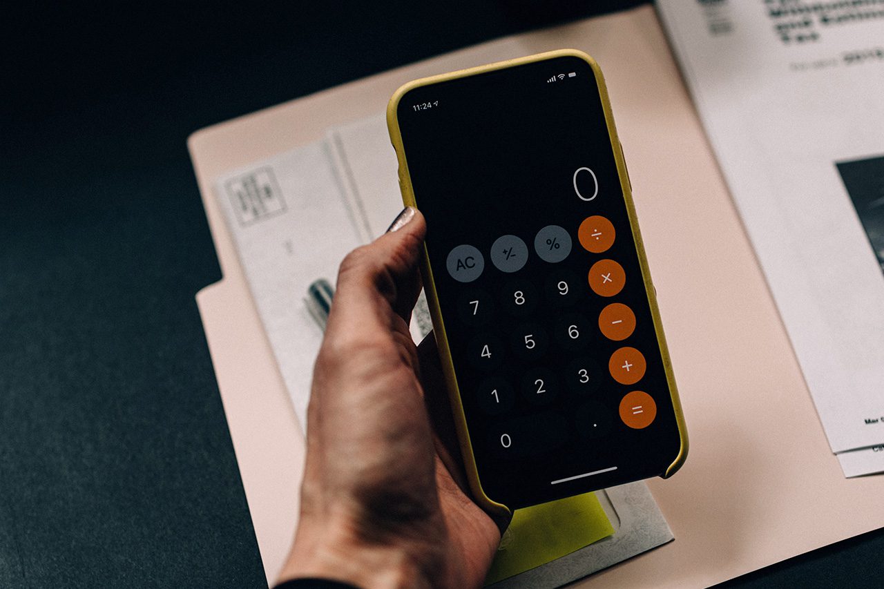 Hand with calculator