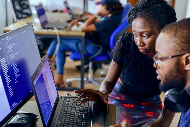 African man and woman at computer