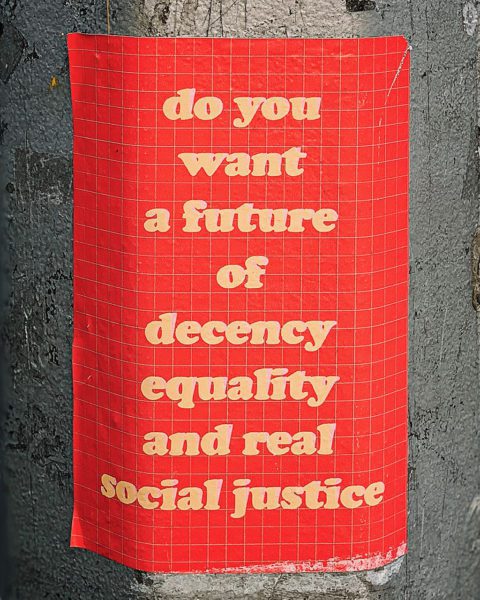 Banner about decency, equality and real social justice
