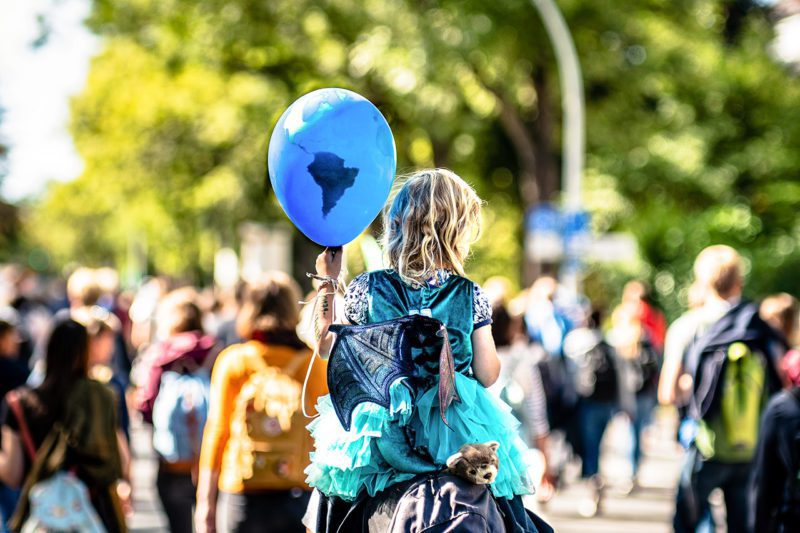 Child on protestor's shoulders