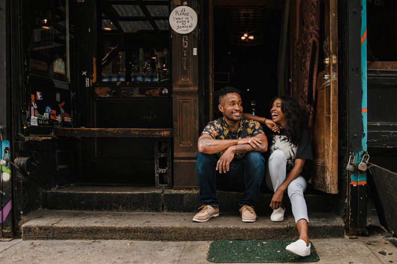 Couple on urban doorstep