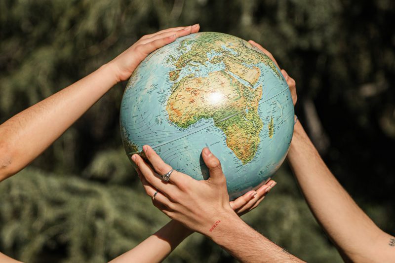 Hands on the globe