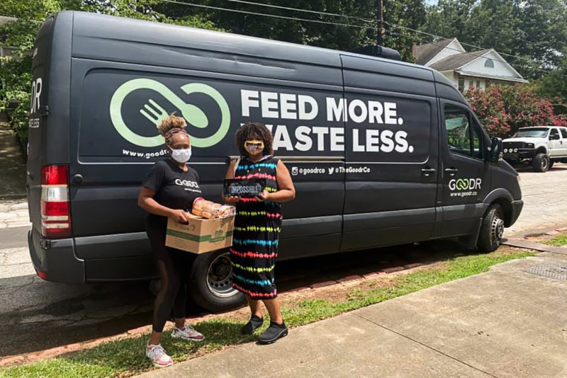 Women in front of Goodr Food Van