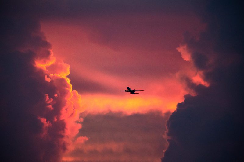 Plane in contrail-free sky