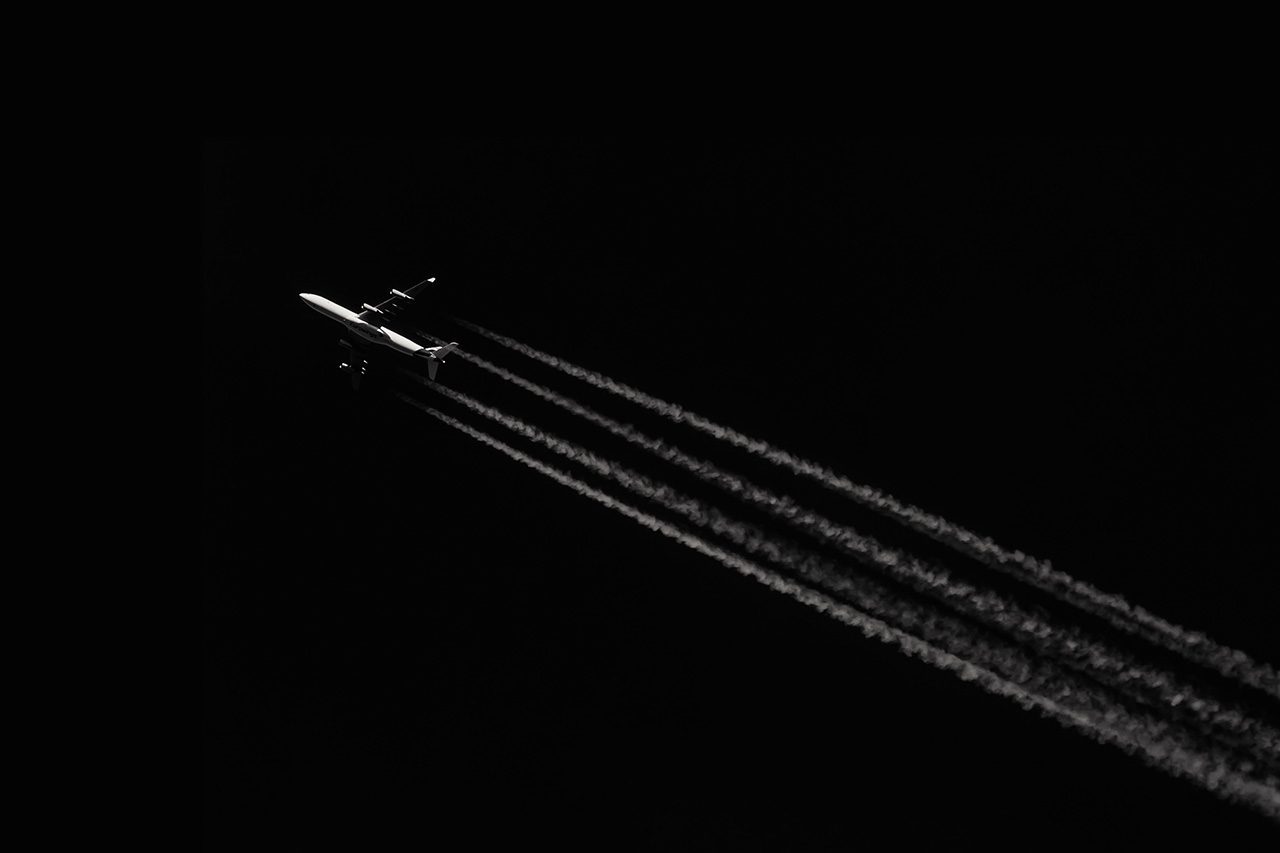 Airplane with contrails