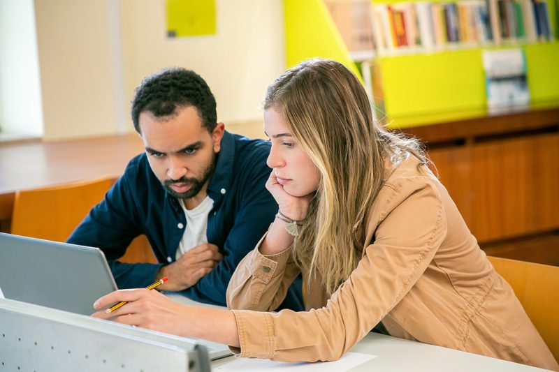Two university students studying