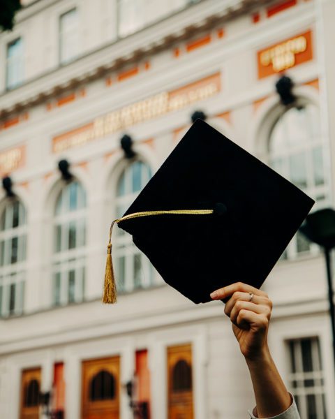 Graduation cap raised high