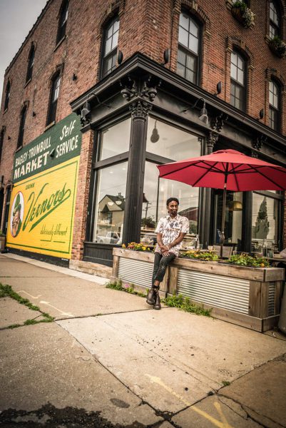 Man under umbrella on Detroit street