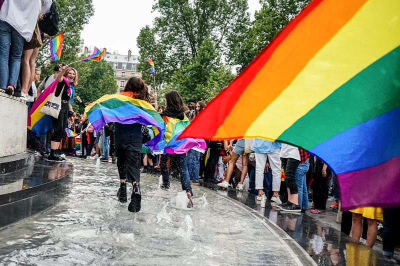 Pride march with rainbow banner