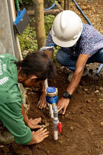 Men digging well