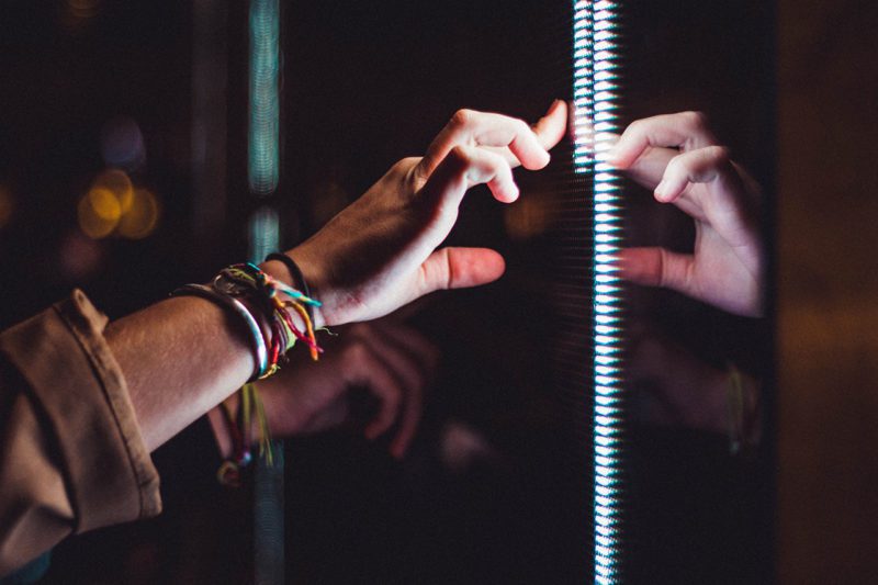 Hand on interactive screen