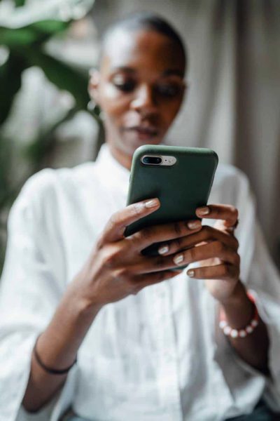 Black woman using fintech app