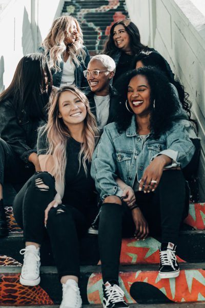 Diverse group of women sitting on steps