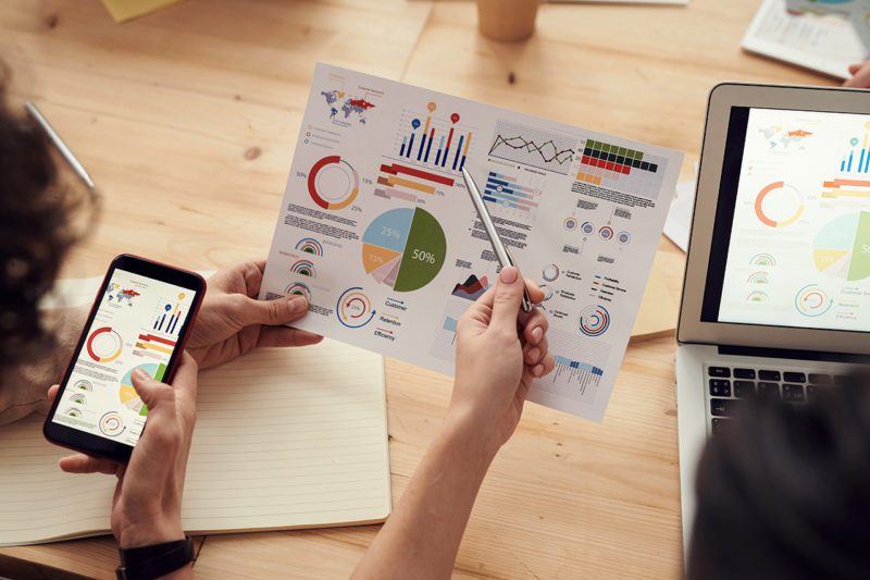 Worker pointing out data on a page