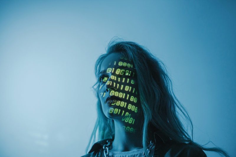 Woman with computer data on side of face