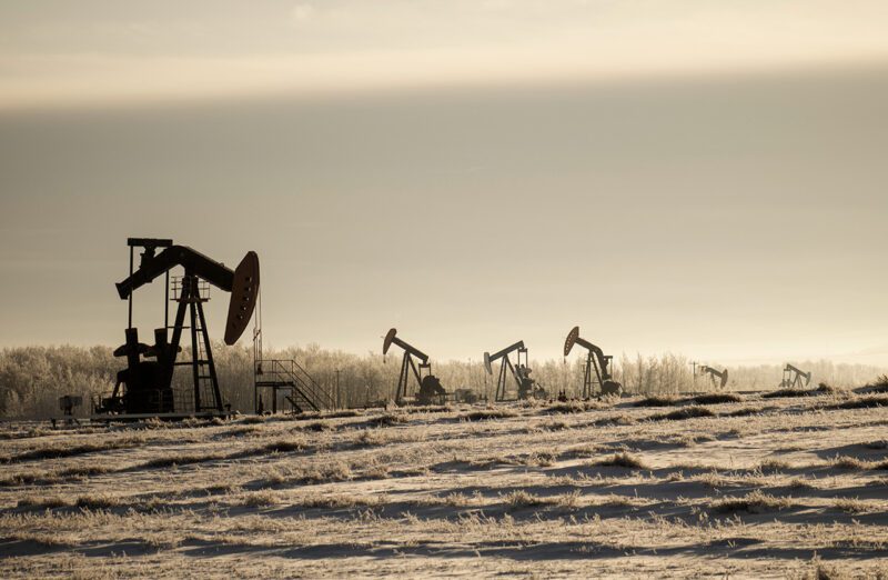 Oil wells in barren landscape