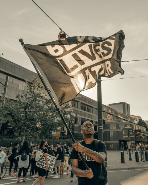 Protest with Black Lives Matter flag