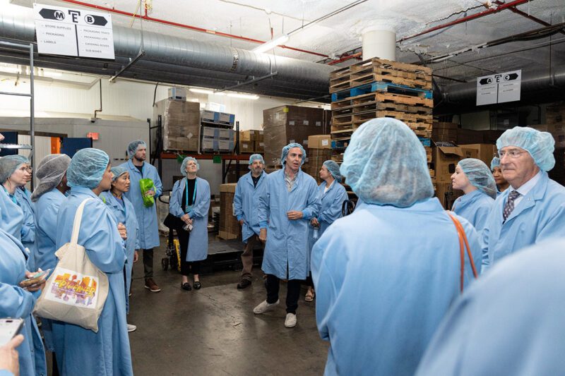 Everytable Founder and CEO Sam Polk leads an Impact in Action tour at the Everytable kitchen facility.
