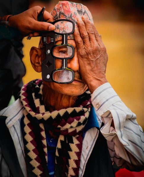 Nepali man being measured for eyeglasses