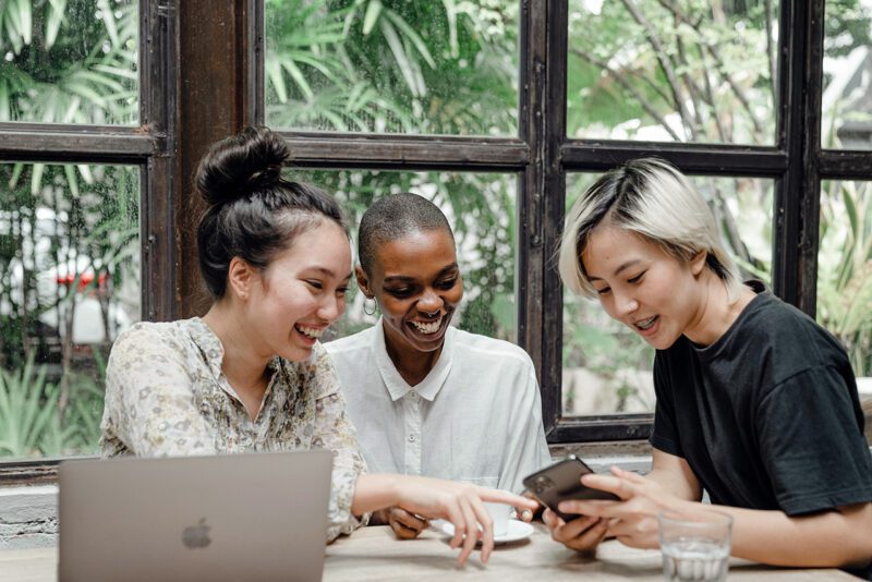 Three diverse women working together
