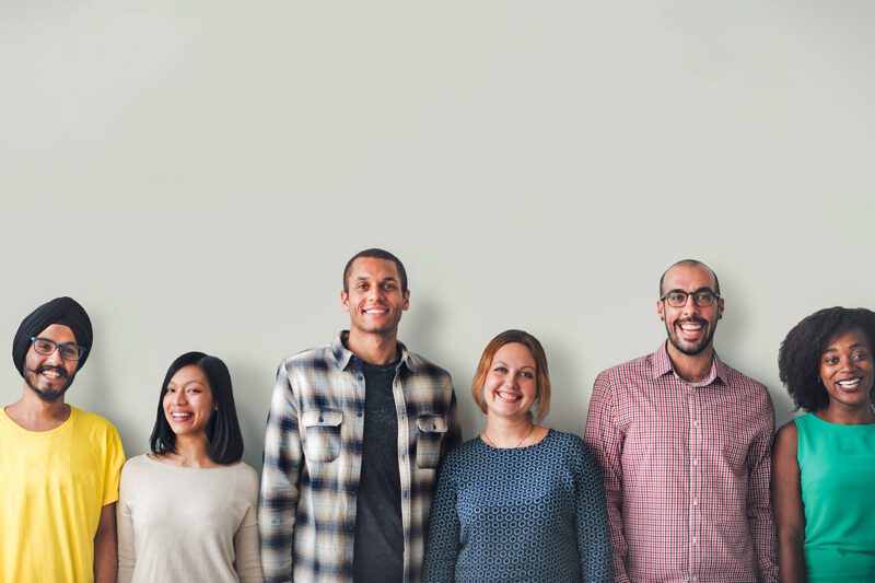 Lineup of smiling diverse people