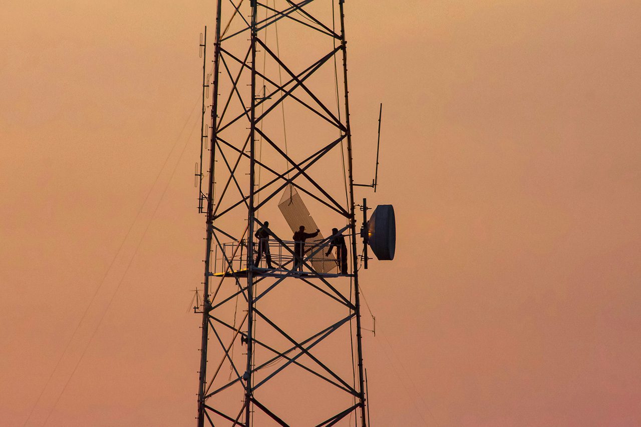 Workers on cell tower