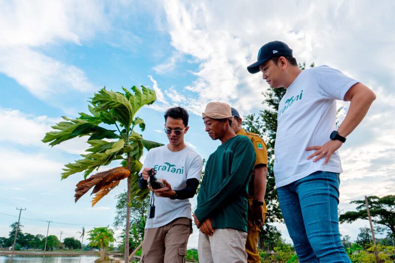 Eratani staff training farmer in Indonesia