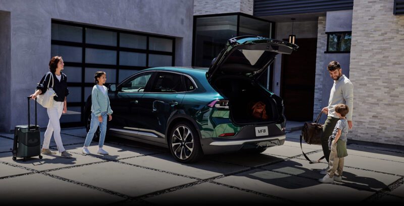 Family people with Vinfast electric vehicle