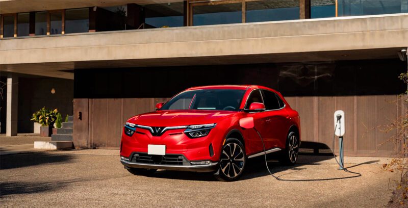 Vinfast electric sedan red at charging station