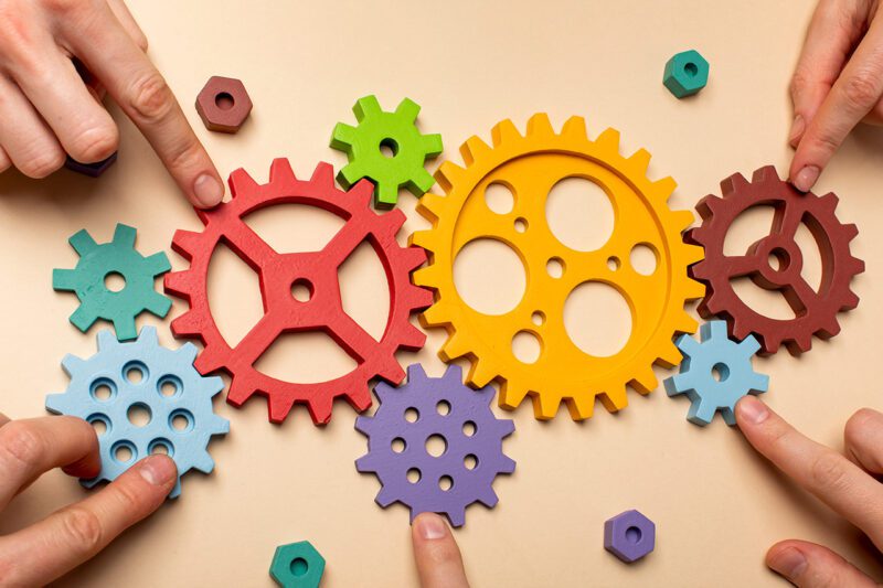 multicolored cogs working together