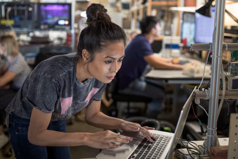 Asian female entrepreneur on laptop