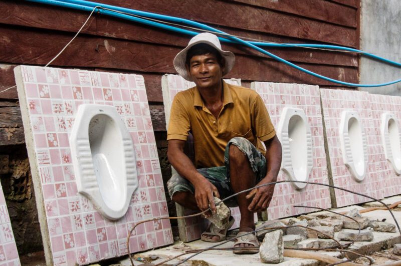 Cambodian worker for the Rural Sanitation Impact Bond