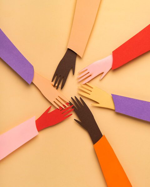 Collage of hands reaching toward each other