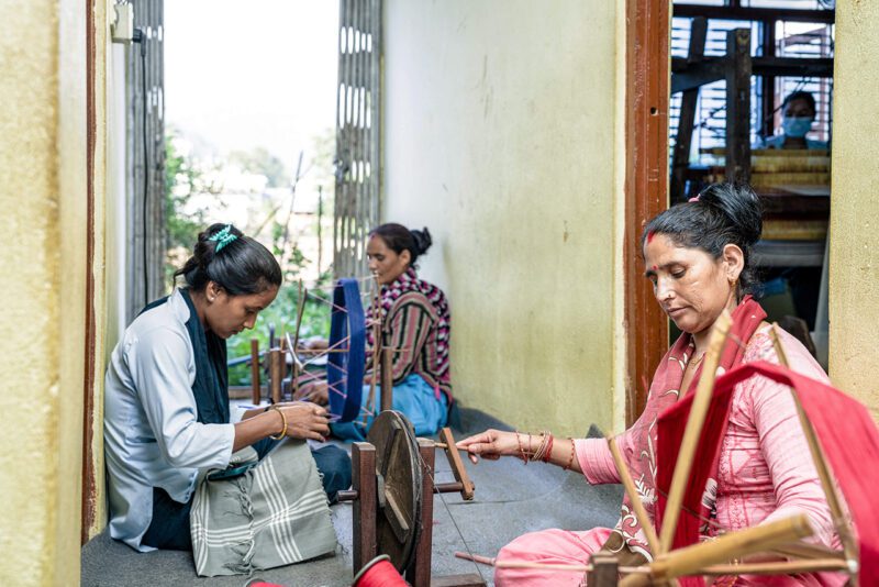 Nepalese women spinning yarn