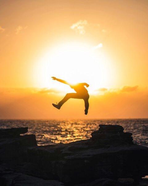 Man jumping into sun