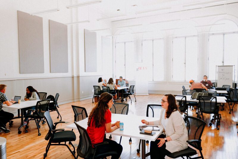 Two women meet in co-working space