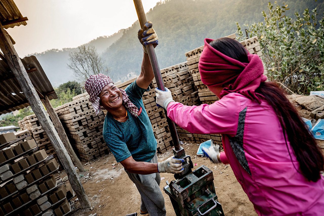 Nepalese Man and woman producing bricks