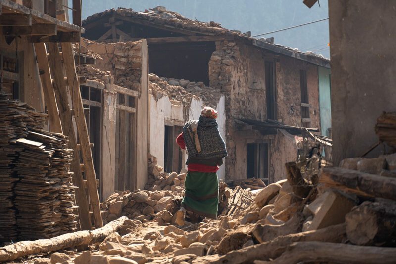 Woman amid Nepal earthquake damage