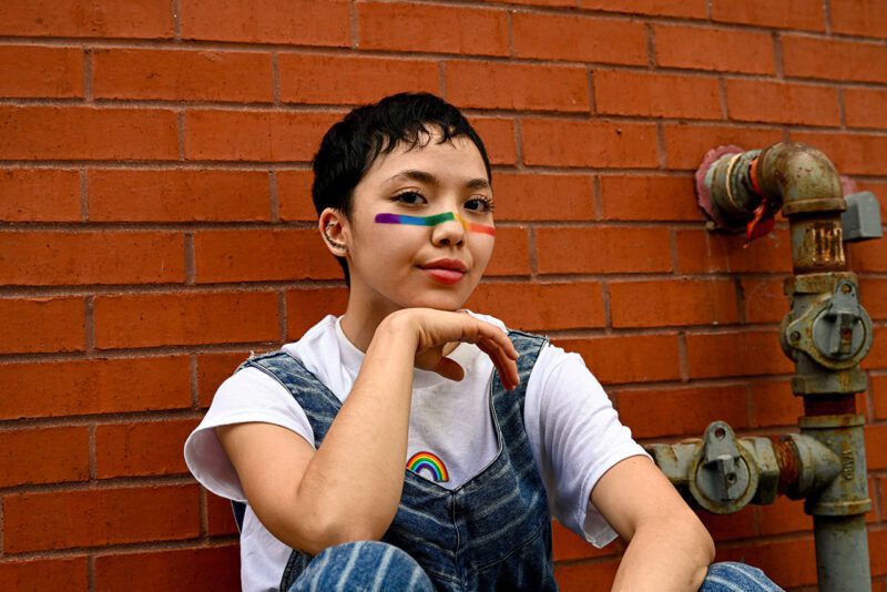 Thai lesbian with flag colored paint on face