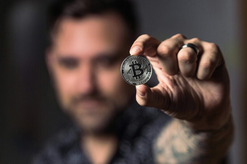 Man holding bitcoin