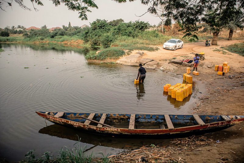 People getting water from river