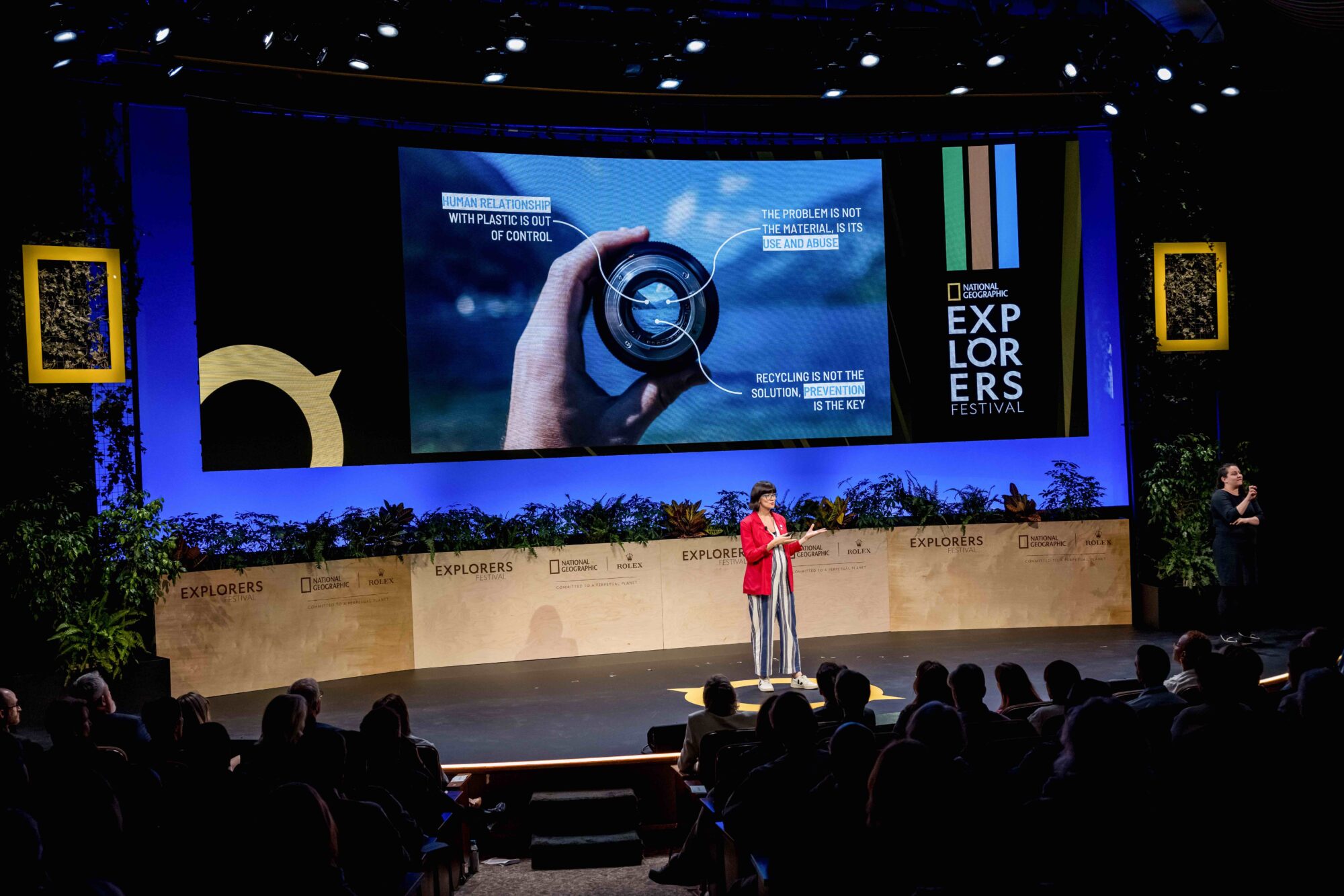 Woman on stage at the National Geographic Explorers Festival Symposium