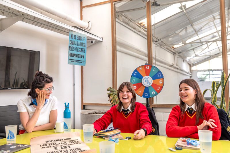 Woman and girls at conference table