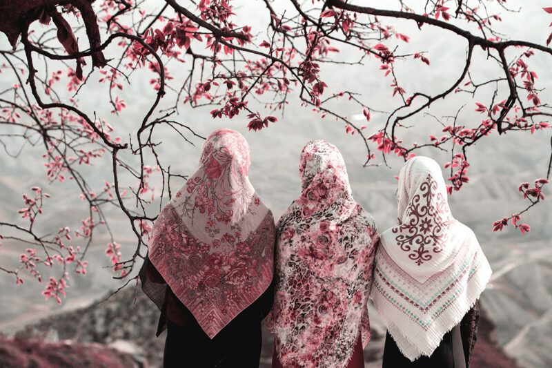 Three Muslim women under tree
