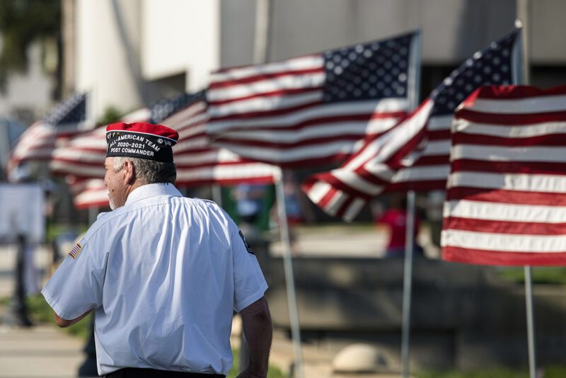 Veteran at rally with flags