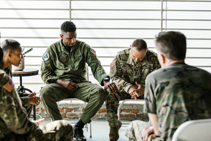 Soldiers in PTSD meeting circle