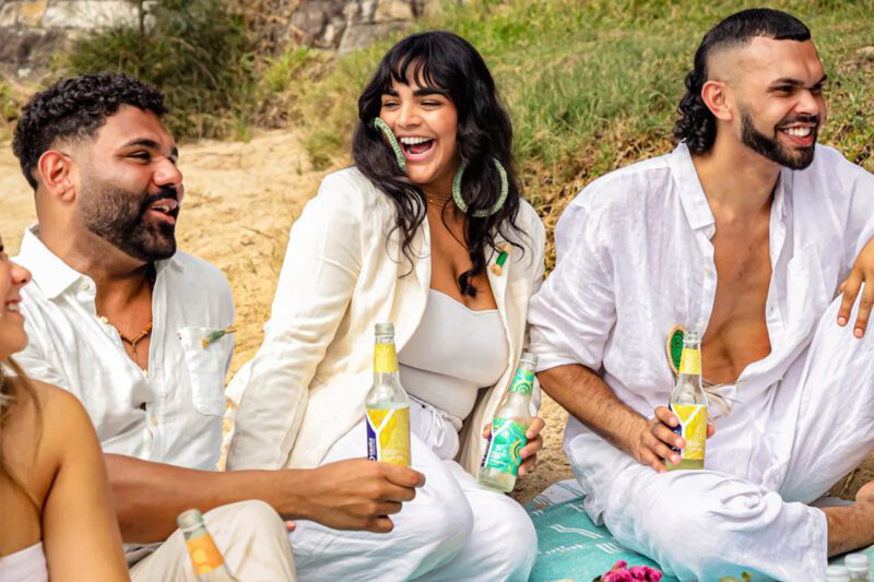 Happy people drinking Yaala sparkling water