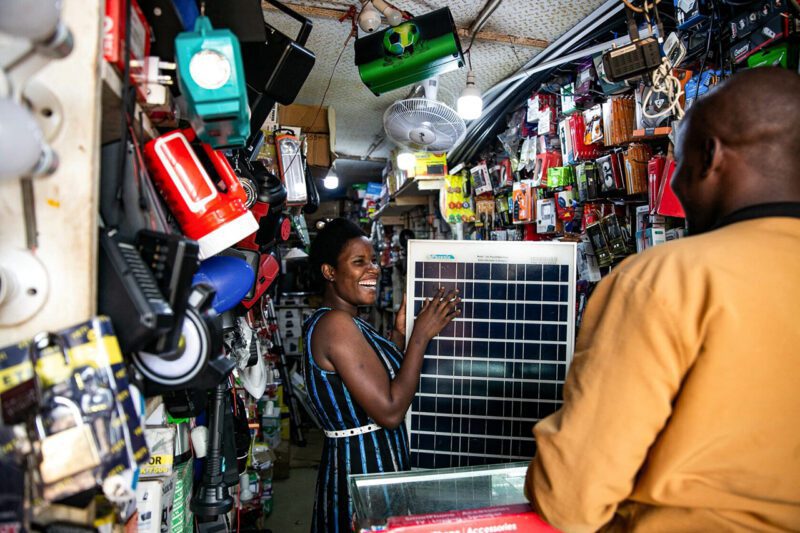 African woman laughing in store